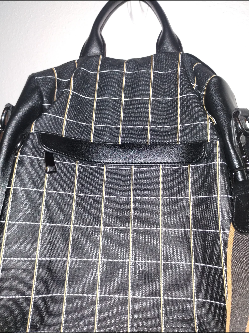 Black Grid-Pattern Backpack with Contrast Brown Strap